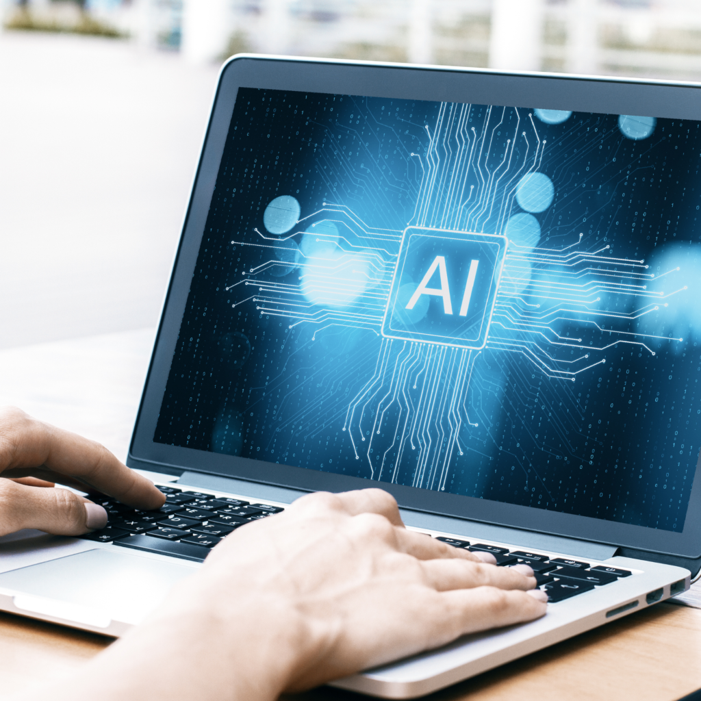 pessoa mexendo no computador com uma tela de IA